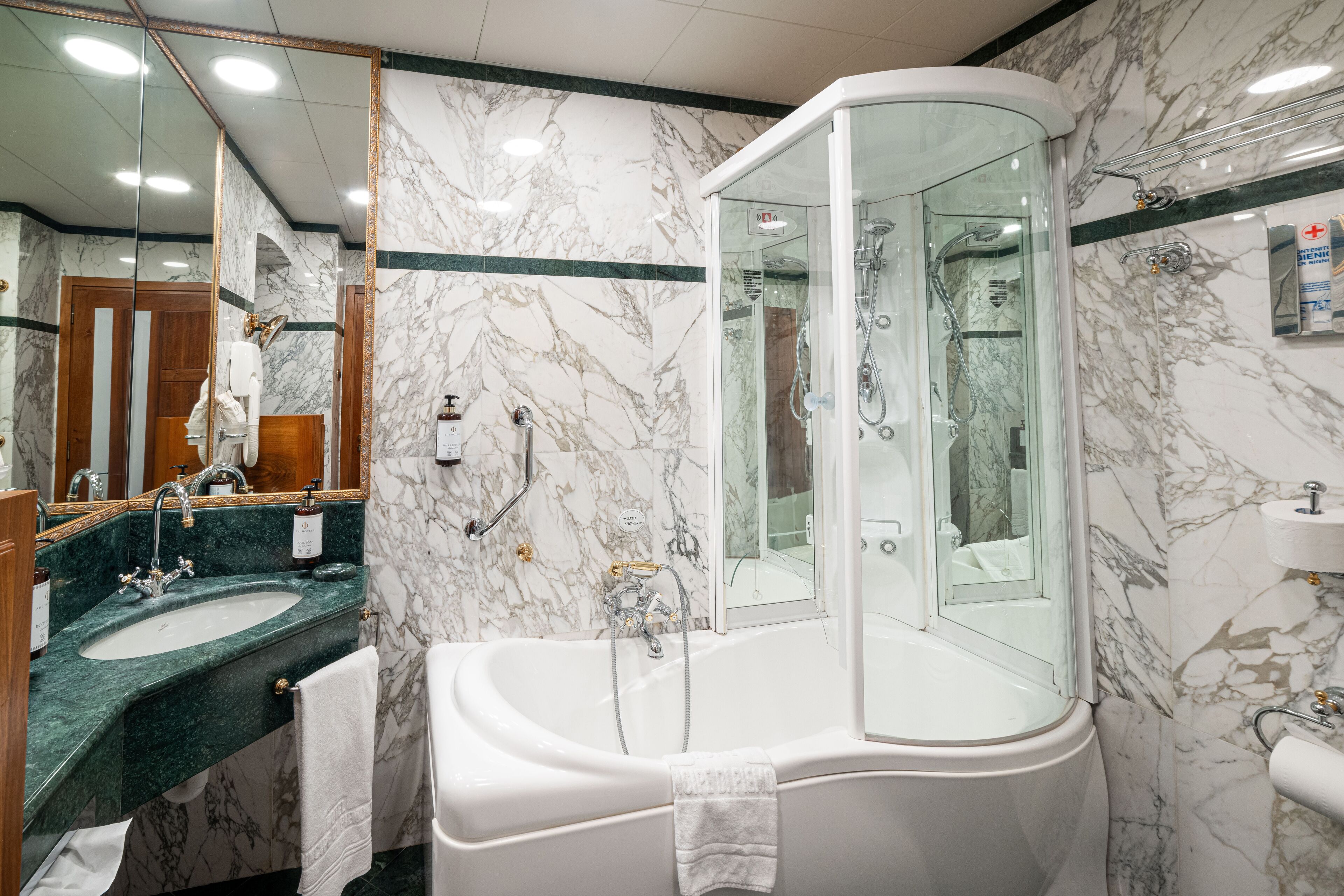 suite | bathroom | deep-soaking bathtub, rainfall showerhead, hair dryer, slippers