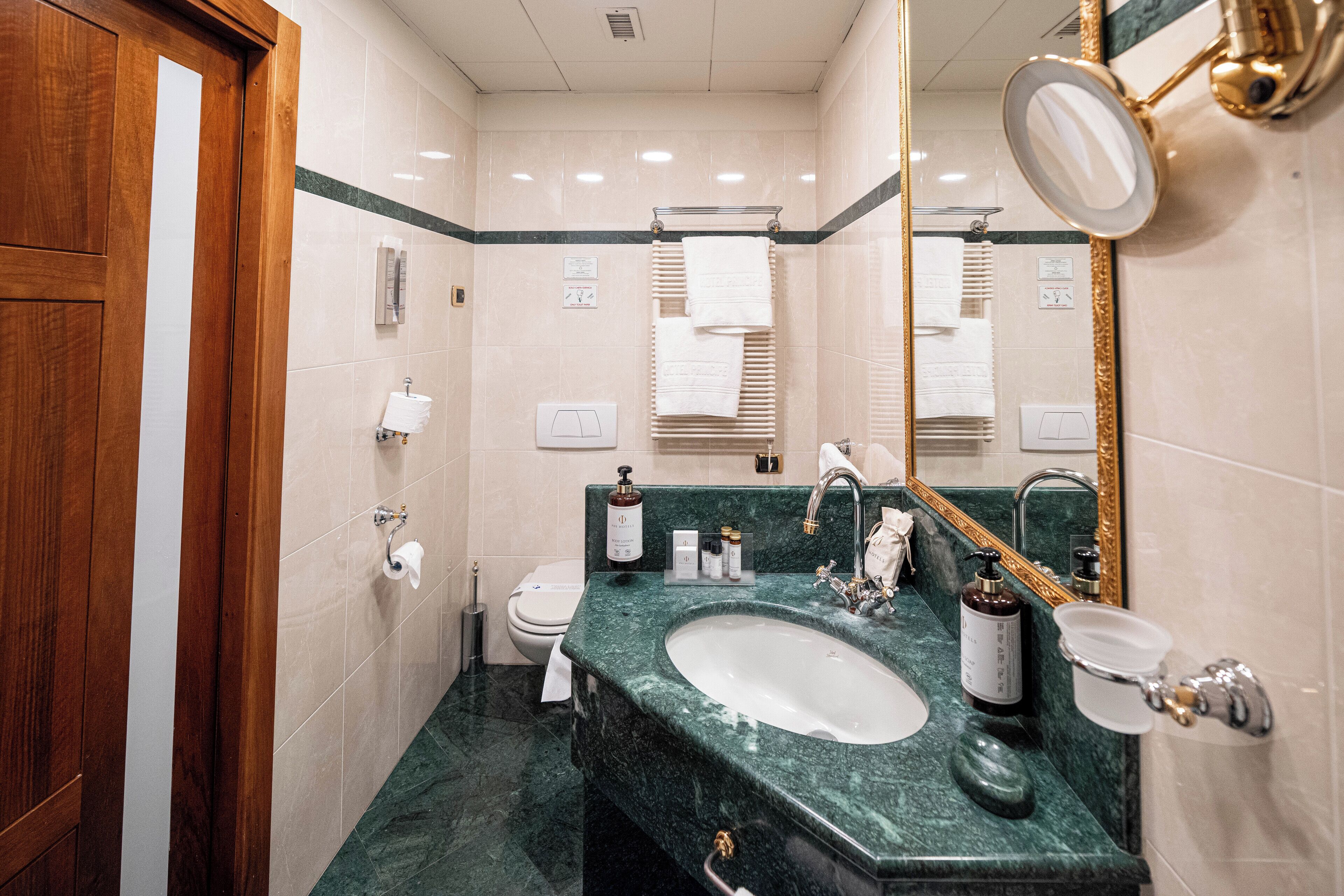 deluxe room | bathroom | deep-soaking bathtub, rainfall showerhead, hair dryer, slippers