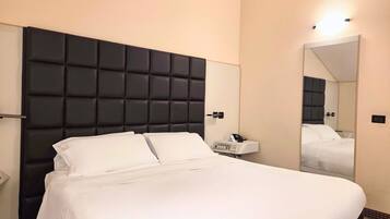 Economy Room | 1 bedroom, premium bedding, minibar, in-room safe
