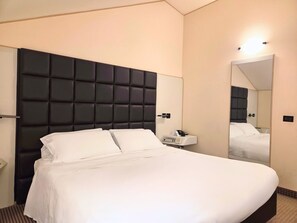 Economy Room | 1 bedroom, premium bedding, minibar, in-room safe