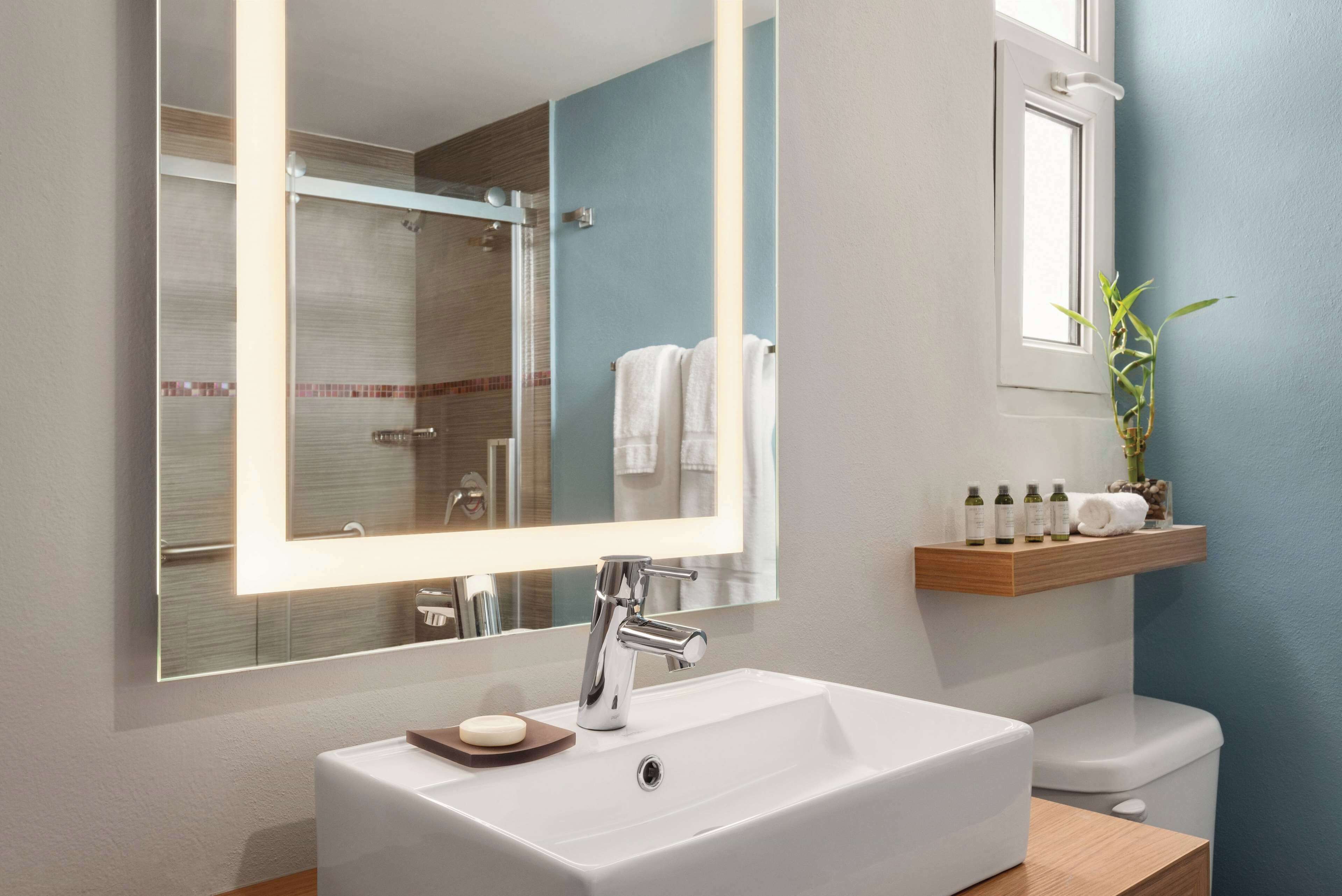 eco-friendly toiletries, hair dryer, towels, soap