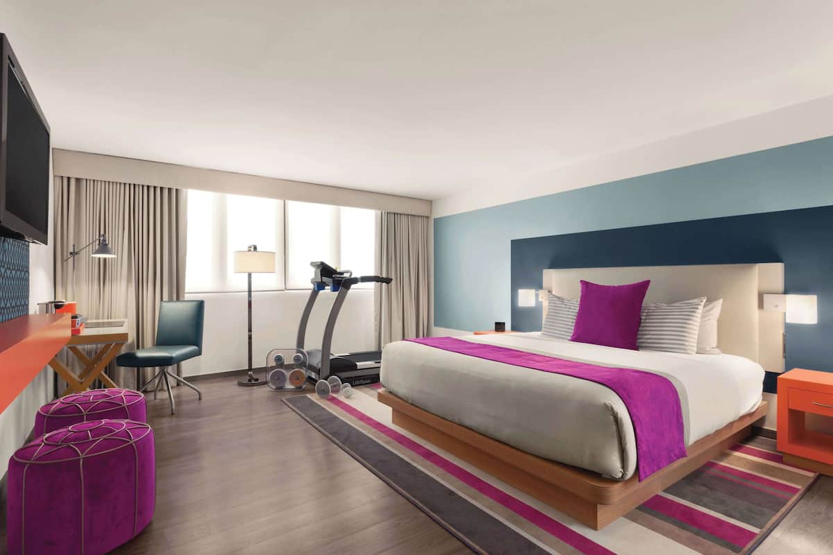 Suite, 1 King Bed (Fitness Suite) | In-room safe, desk, blackout drapes, iron/ironing board