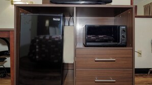 A kitchenette with a black refrigerator and a microwave. - Red Roof Inn Edgewood (Edgewood)