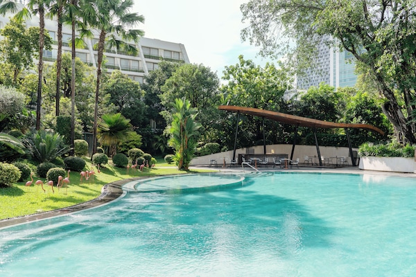 Outdoor pool, open 6:00 AM to 9:00 PM, pool umbrellas, pool loungers