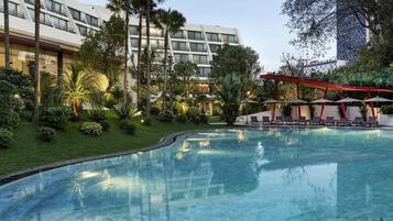 Outdoor pool, open 6:00 AM to 9:00 PM, pool umbrellas, sun loungers