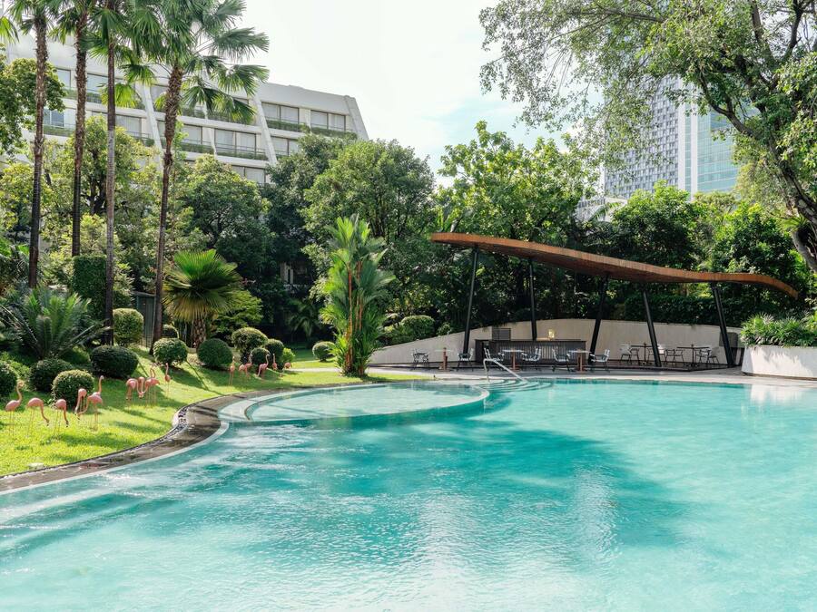 Outdoor pool, open 6:00 AM to 9:00 PM, pool umbrellas, pool loungers