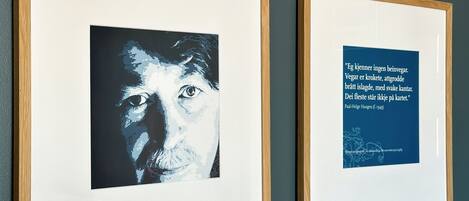 Two framed artworks on a wall.