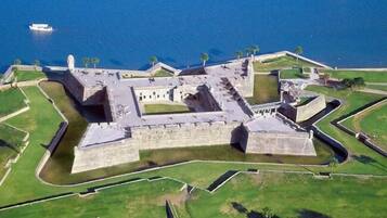 An aerial view of a historic fort with multiple bastions and a moat.