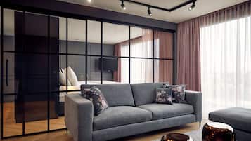Luxe suite | Woonkamer | Een 22-inch flatscreentelevisie met kabelzenders en televisie
