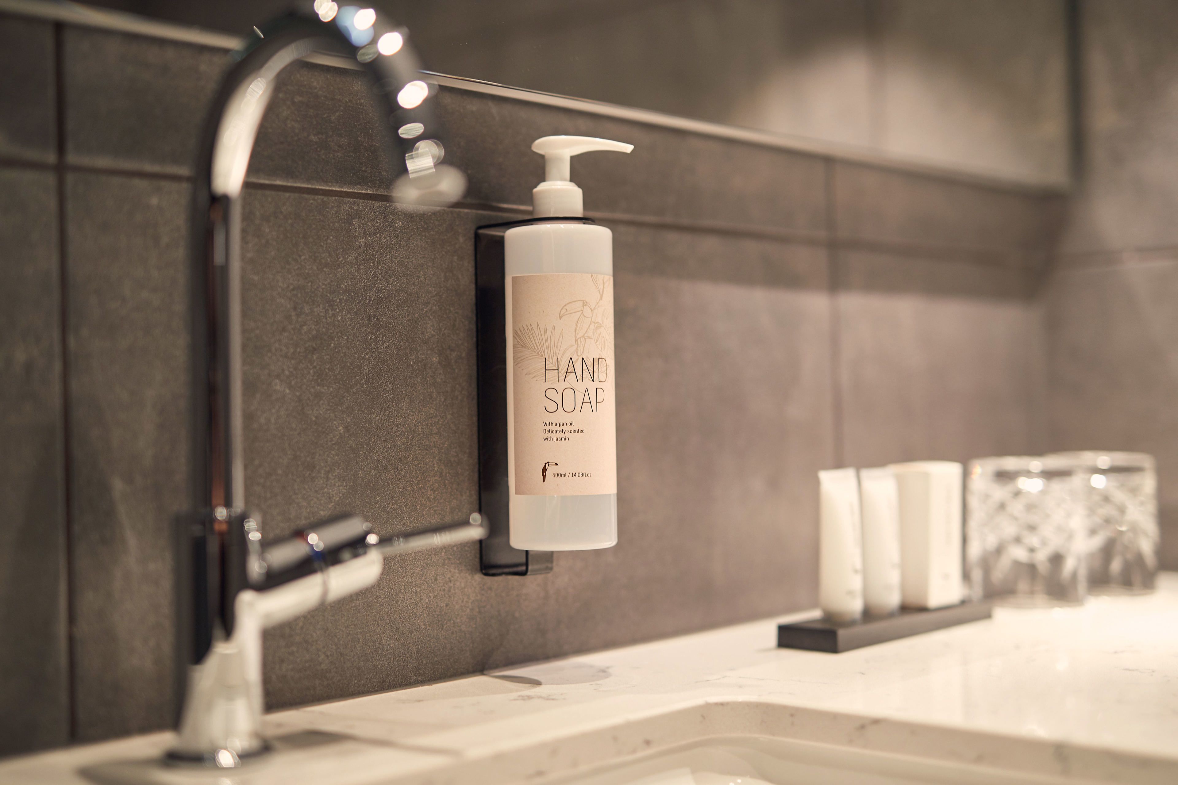 eco-friendly toiletries, hair dryer, slippers, towels