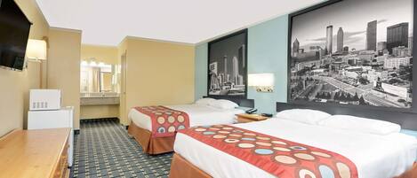 A hotel room with two beds, a desk, a TV, and a cityscape wall.