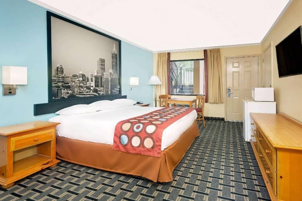 Desk, laptop workspace, blackout curtains, iron/ironing board