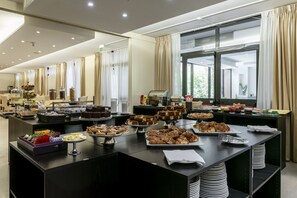 Indulge in a variety of sweet and savory options at our buffet, featuring pastries, cakes, and more, along with hot beverages available at the coffee and tea stations.