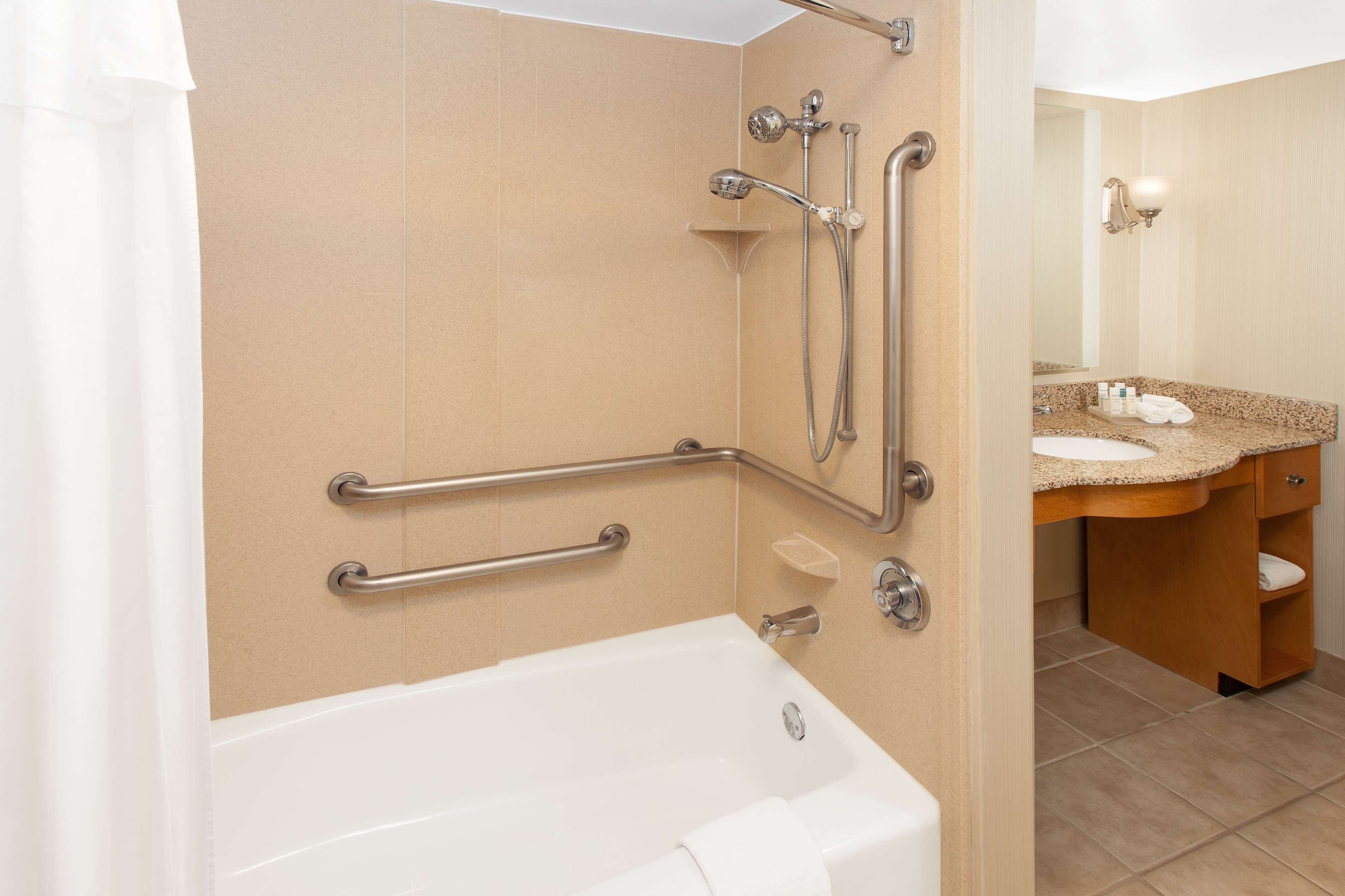 suite, 1 queen bed, accessible, bathtub | bathroom | combined shower/bathtub, free toiletries, hair dryer, towels