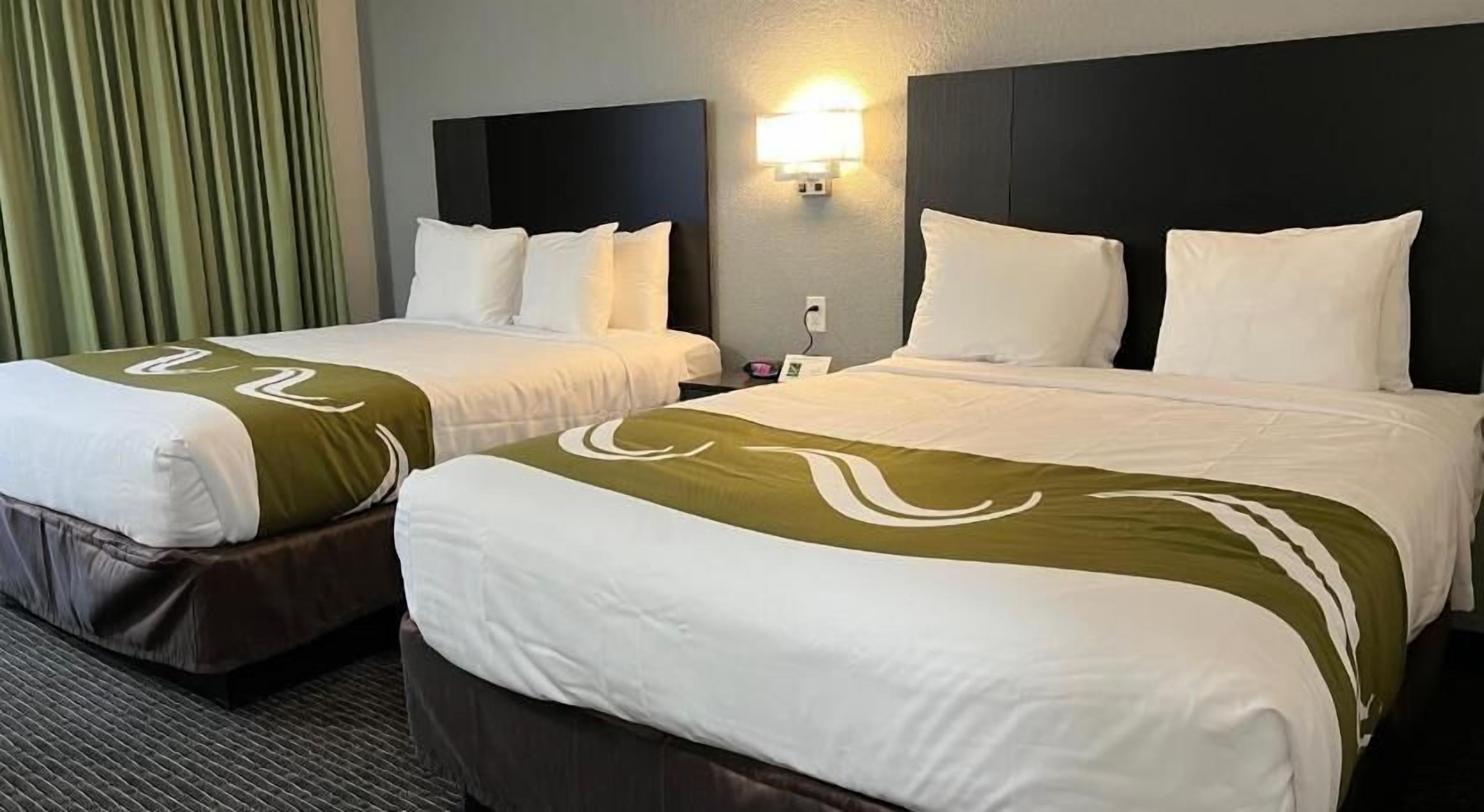 Premium bedding, down comforters, blackout drapes, iron/ironing board