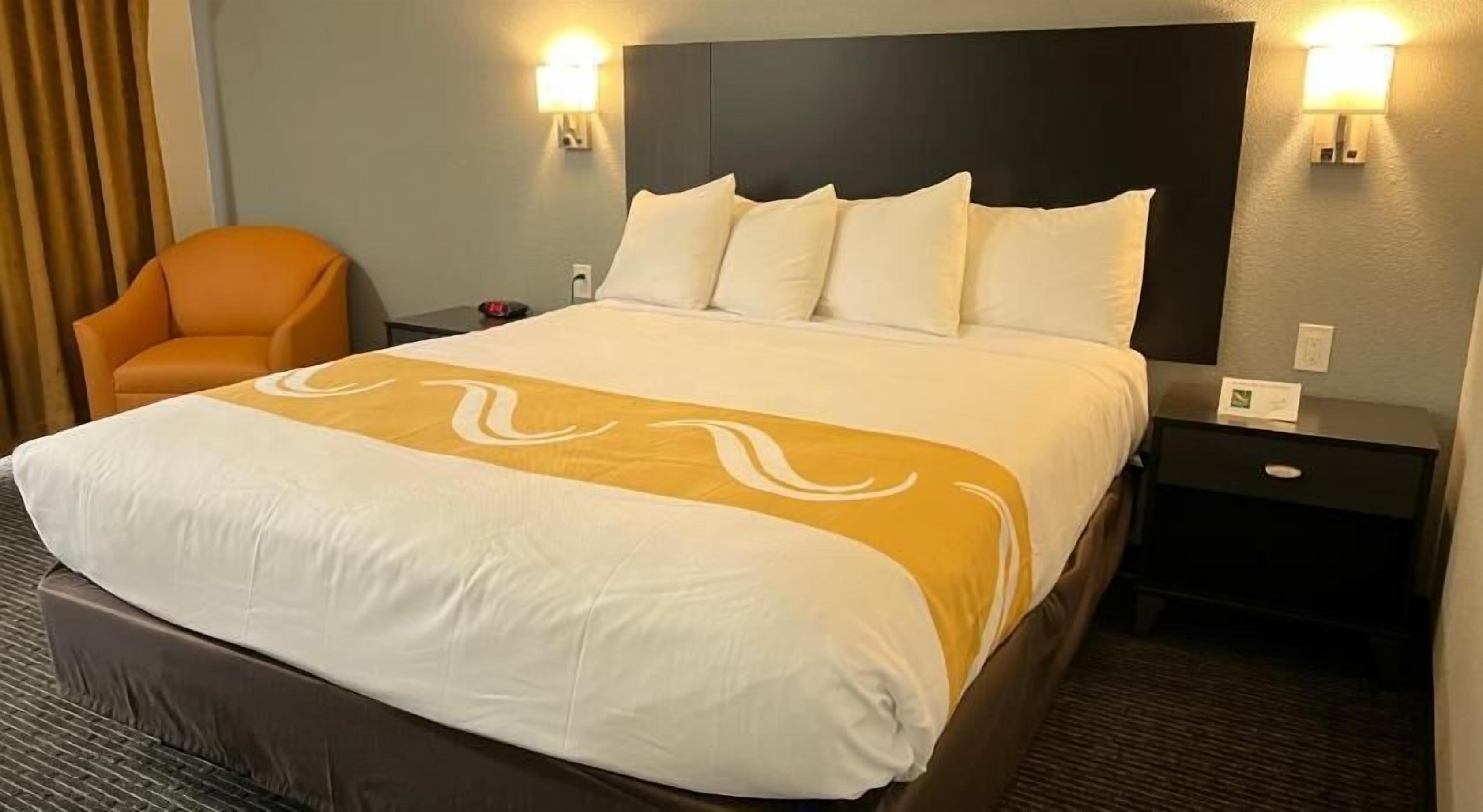 Premium bedding, down comforters, blackout drapes, iron/ironing board