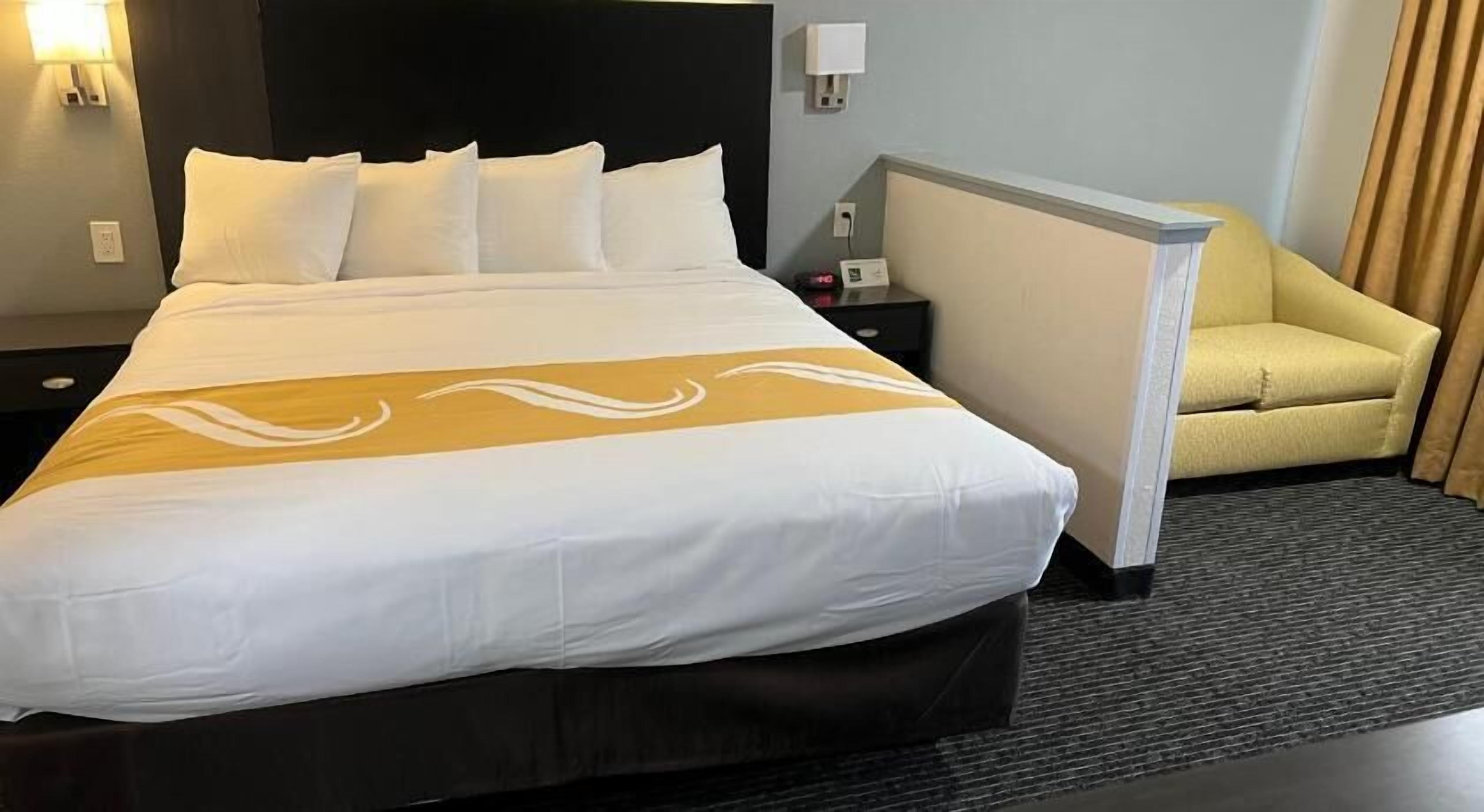 Premium bedding, down comforters, blackout drapes, iron/ironing board