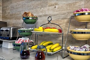 A kitchen counter with various food items and kitchen appliances. - Quality Inn & Suites South San Jose / Morgan Hill (Morgan Hill)