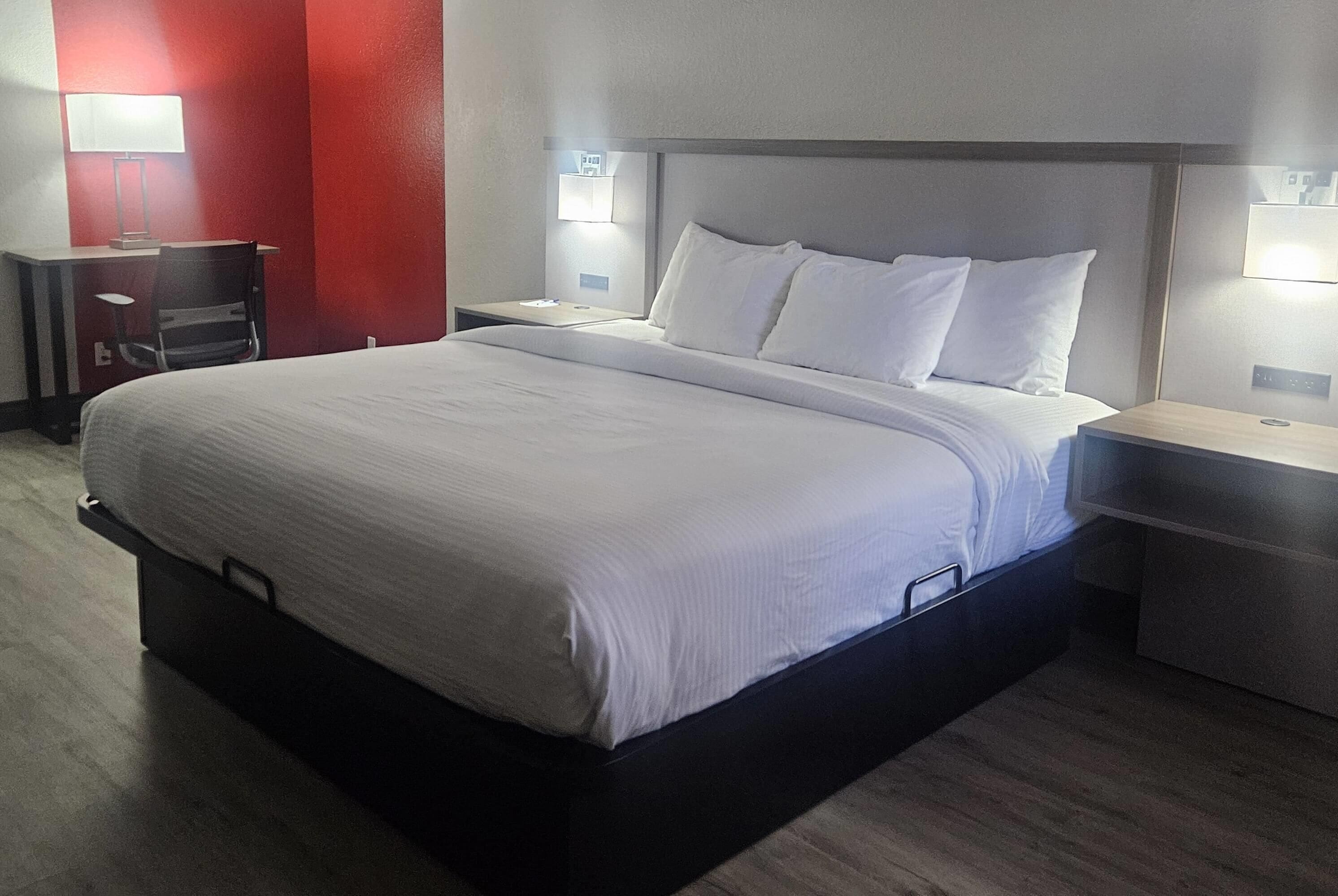 Premium bedding, desk, laptop workspace, iron/ironing board