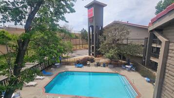 Seasonal outdoor pool, pool umbrellas, pool loungers