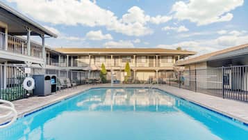 Outdoor pool, open 9:00 AM to 9:00 PM, pool umbrellas, sun loungers