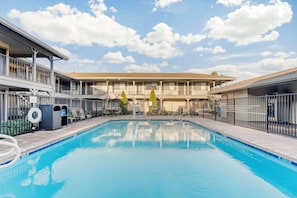 Outdoor pool, open 9:00 AM to 9:00 PM, pool umbrellas, sun loungers