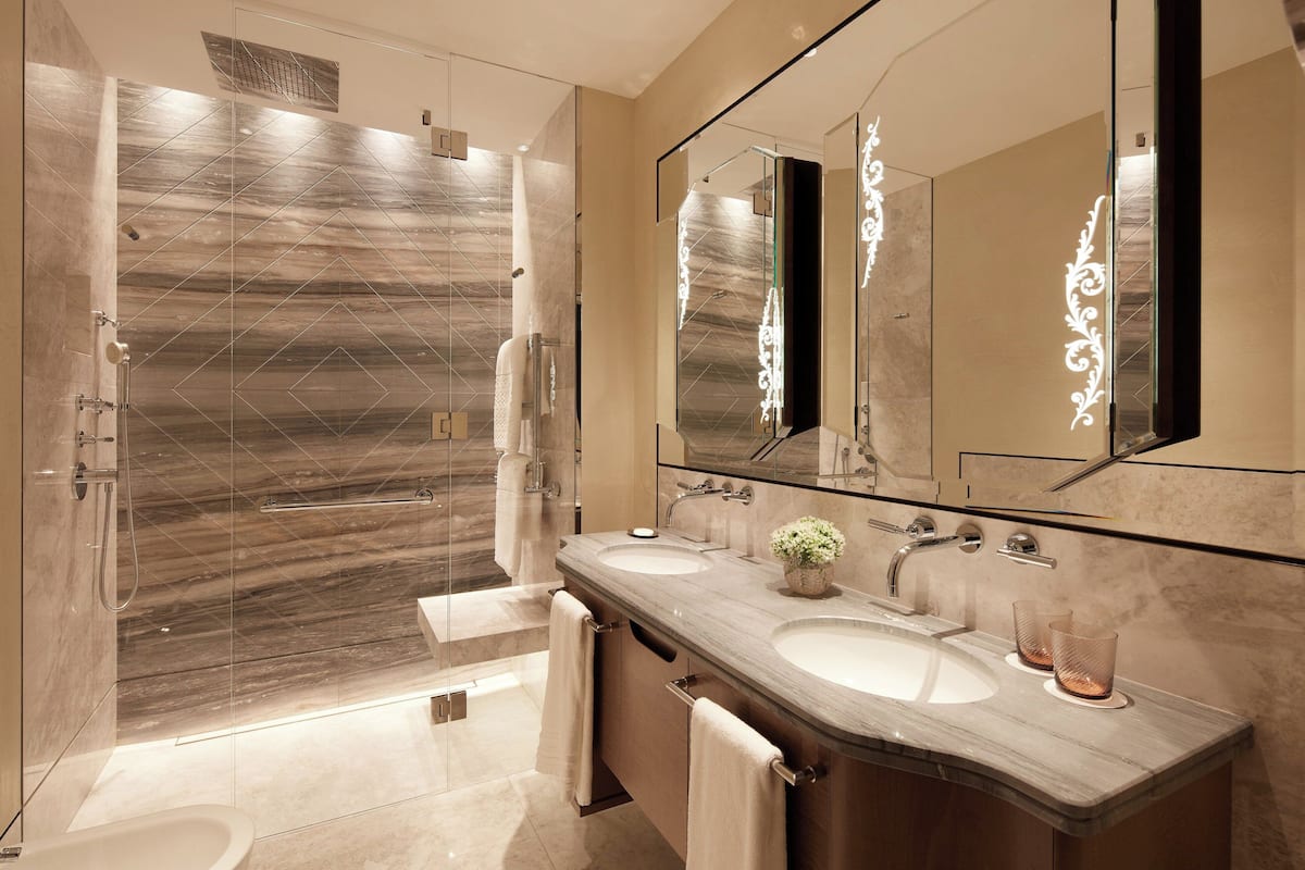 designer toiletries, hair dryer, bathrobes, slippers