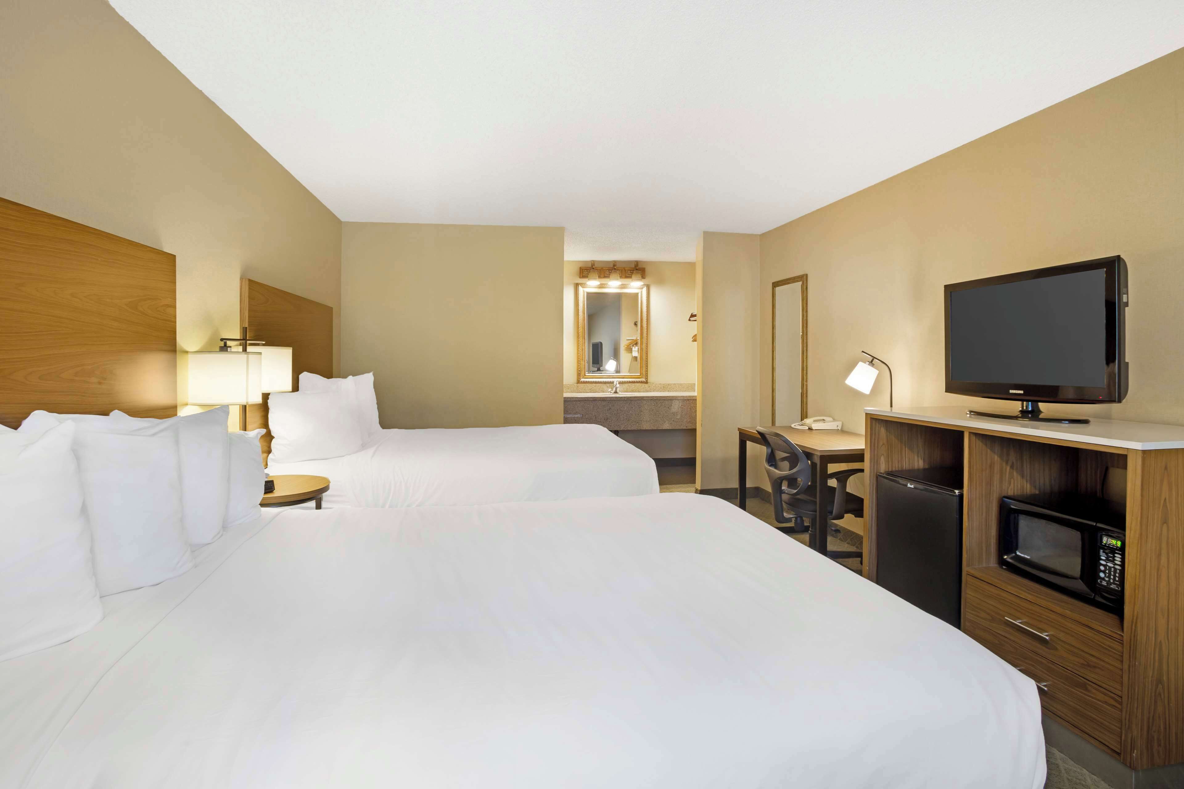 standard room, 2 queen beds, non smoking, refrigerator & microwave | desk, iron/ironing board, free wifi, bed sheets