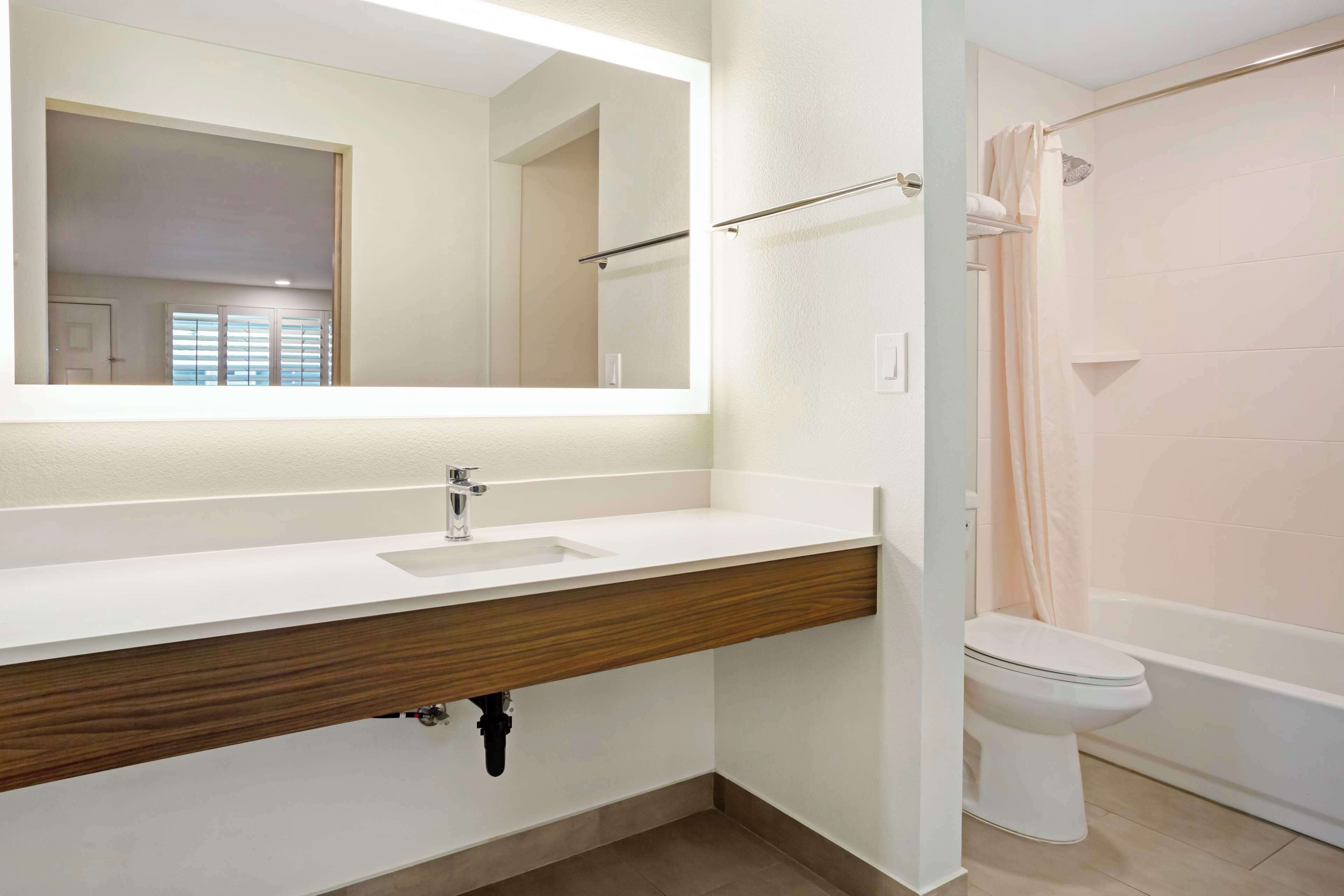 standard room, 2 queen beds, non smoking, refrigerator & microwave (with sofabed) | bathroom | combined shower/bathtub, eco-friendly toiletries, hair dryer, towels