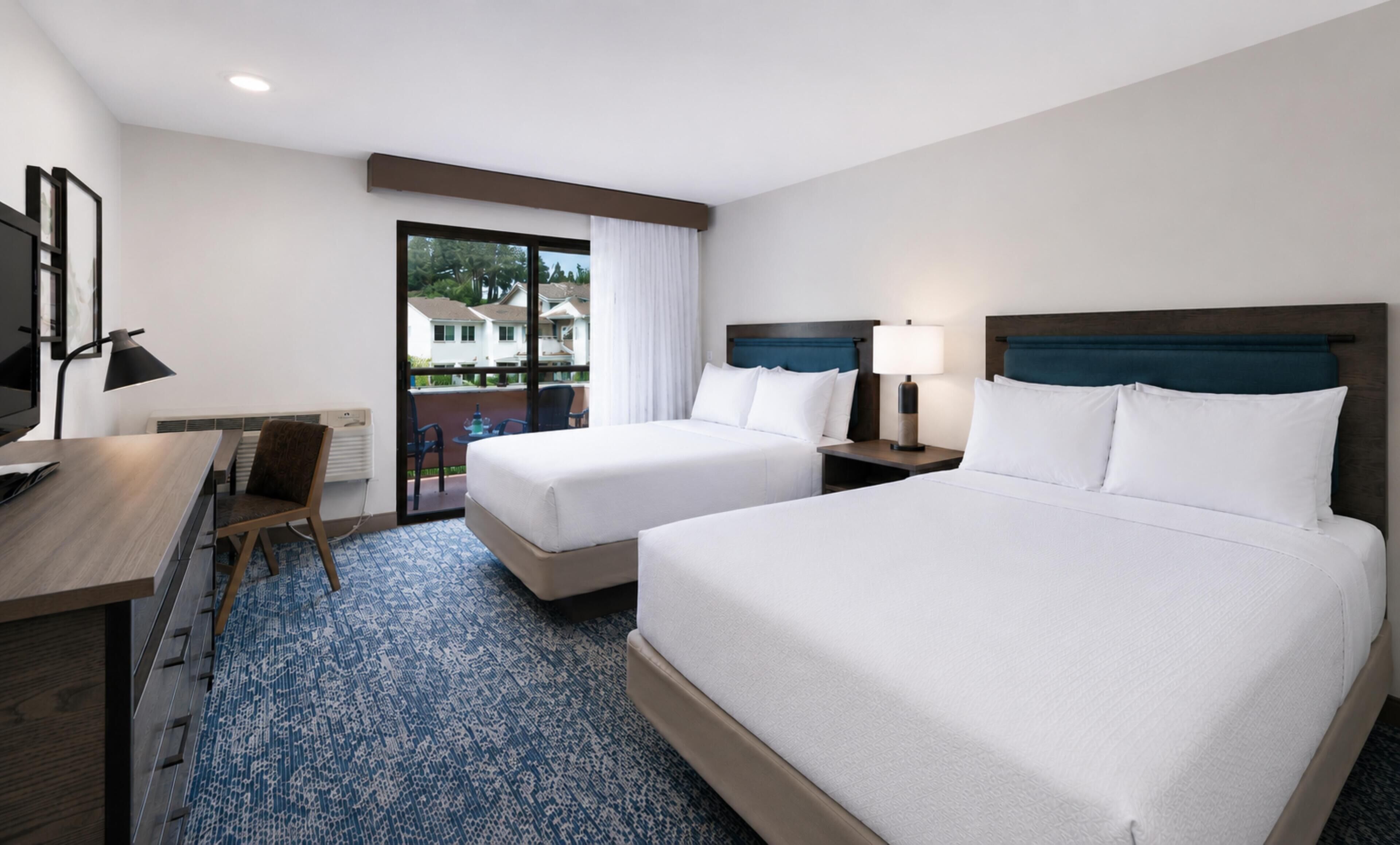 Room, 2 Queen Beds, Garden View | Pillowtop beds, in-room safe, desk, laptop workspace