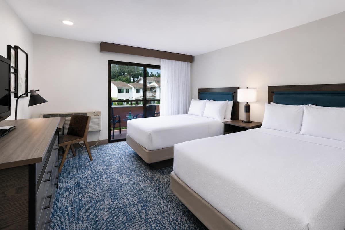 Room, 2 Queen Beds, Garden View | Pillowtop beds, in-room safe, desk, laptop workspace