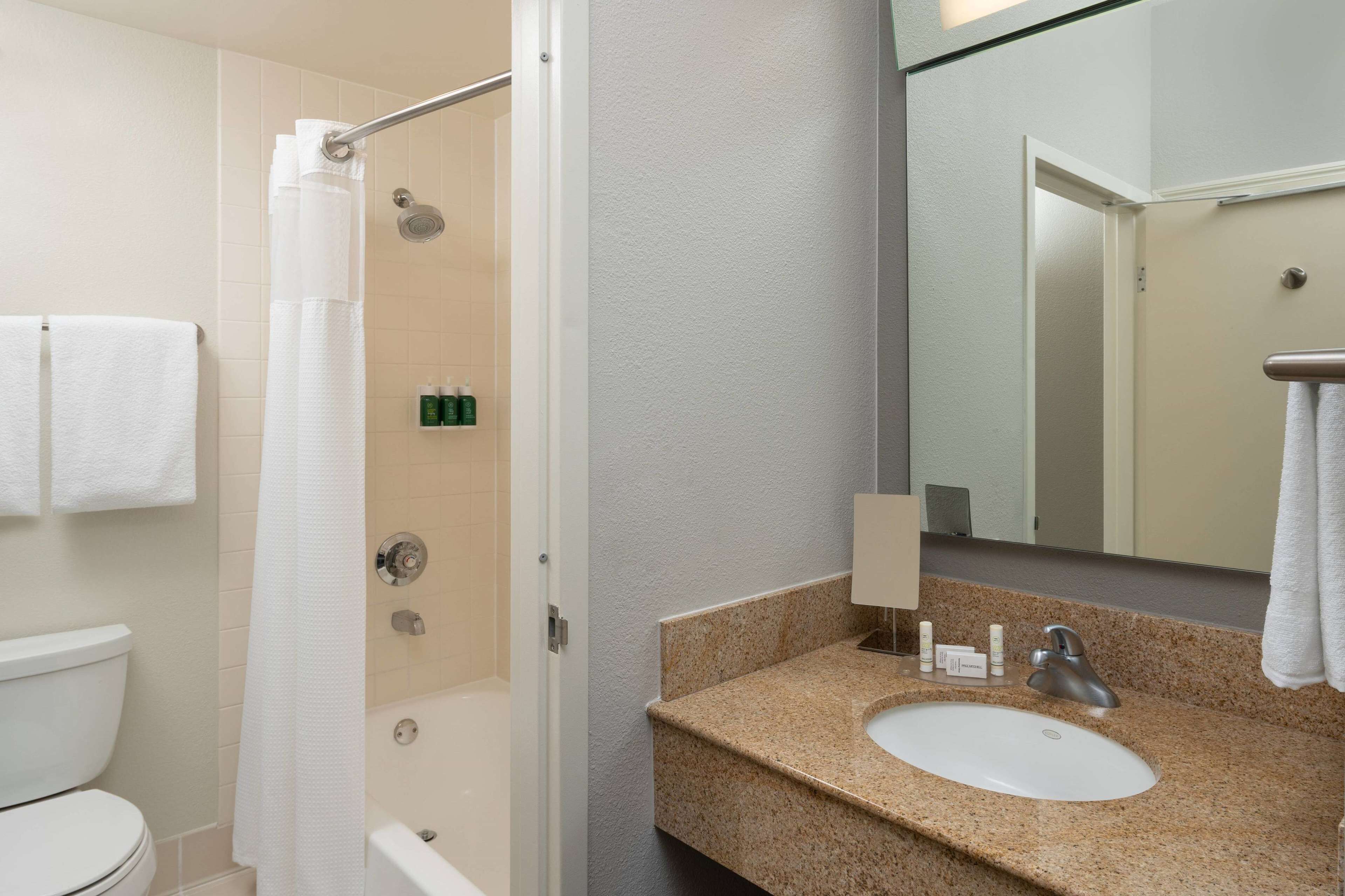 combined shower/bathtub, eco-friendly toiletries, hair dryer, towels