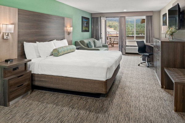 Suite, 1 King Bed with Sofa bed, Balcony | In-room safe, desk, laptop workspace, blackout drapes