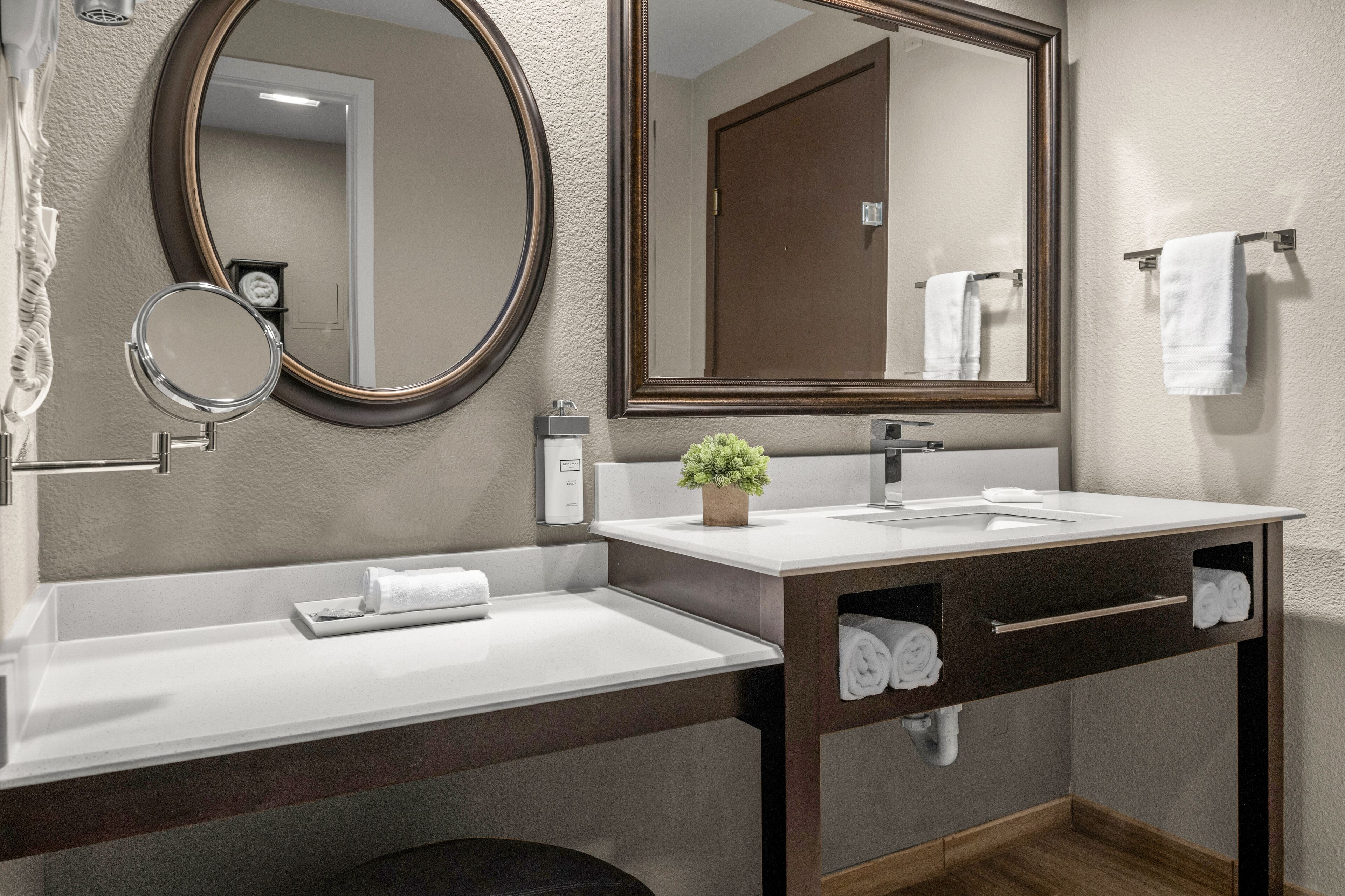 combined shower/bathtub, deep-soaking bathtub, designer toiletries