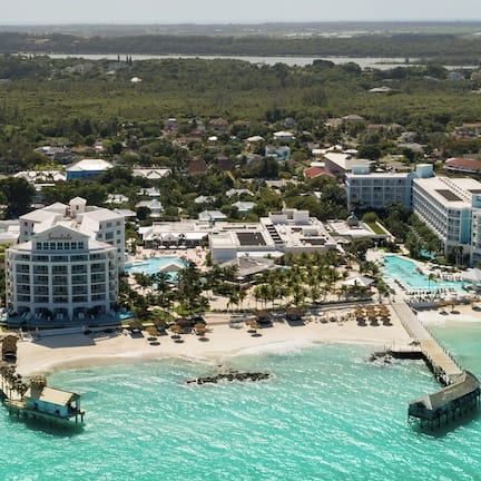 On the beach, white sand, sun loungers, beach umbrellas