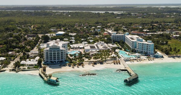 On the beach, white sand, sun loungers, beach umbrellas