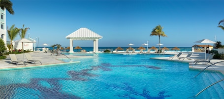 7 outdoor pools, pool umbrellas, sun loungers. Sandals Royal Bahamian - ALL INCLUSIVE Couples Only