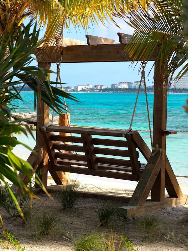 On the beach, white sand, sun loungers, beach umbrellas