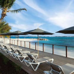 On the beach, white sand, sun-loungers, beach umbrellas
