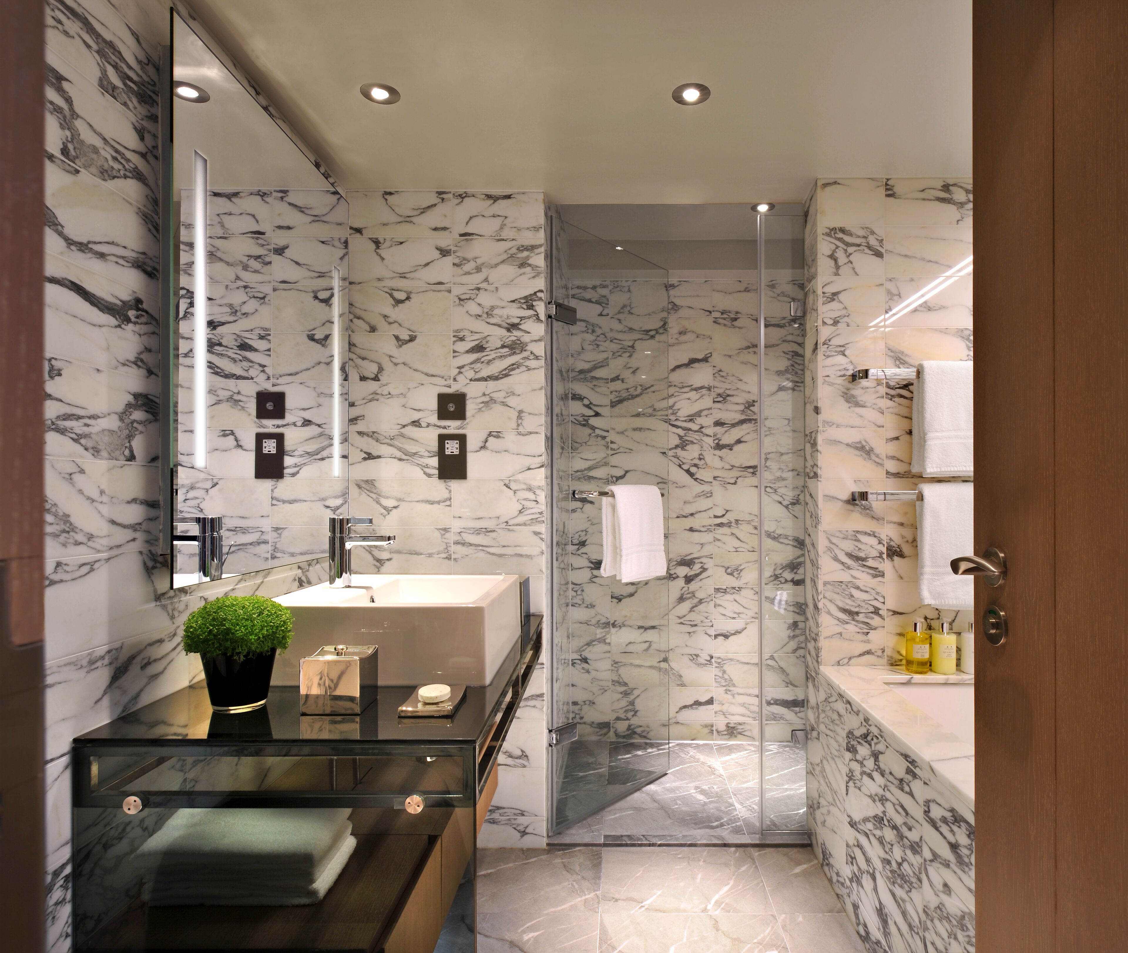 Designer toiletries, hair dryer, bathrobes, slippers