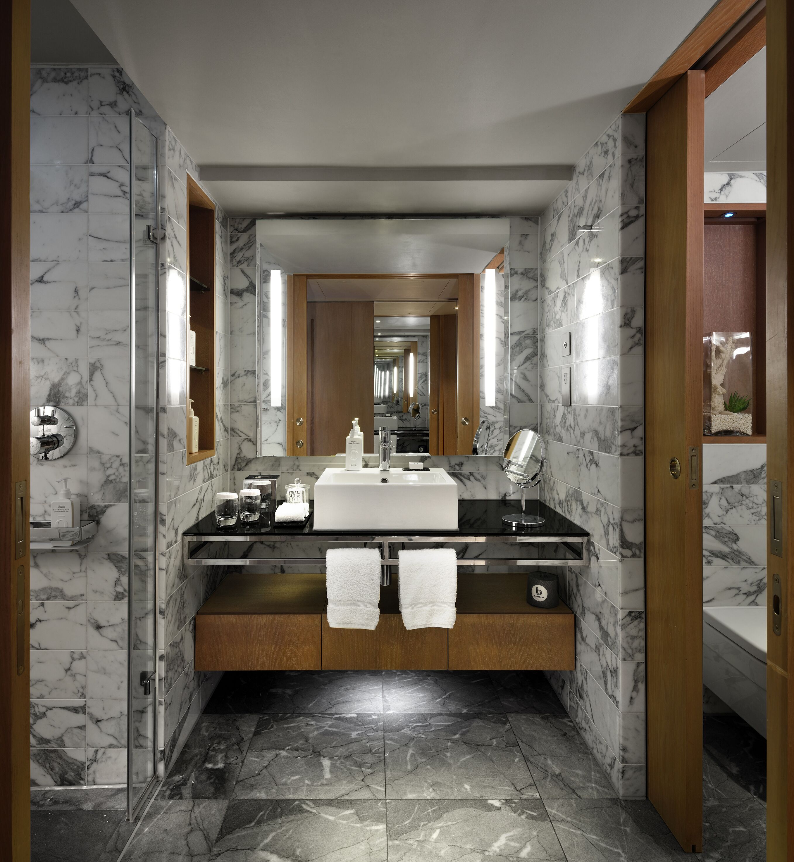 designer toiletries, hair dryer, bathrobes, slippers