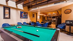 A pool table with balls, blue chairs, and a bar area with a Sierra Nevada sign. - Best Western El Grande Inn (Clearlake)