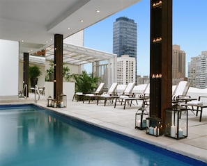 Seasonal outdoor pool, open 11:00 AM to 7:00 PM, pool umbrellas
