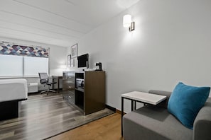 Premium bedding, pillow-top beds, desk, laptop workspace