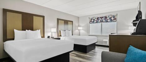 Premium bedding, pillow-top beds, desk, laptop workspace