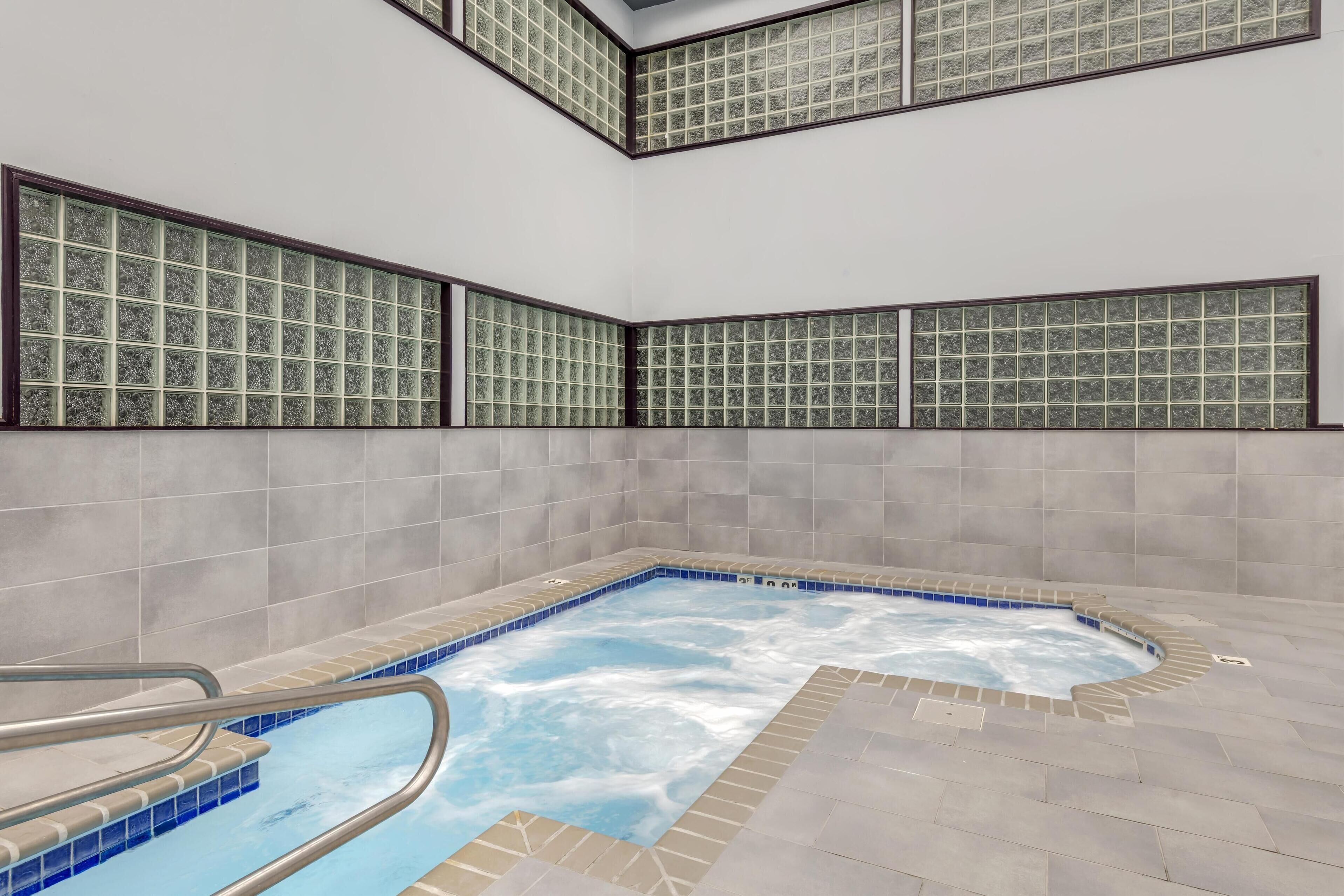 indoor pool, open 9:00 am to 10:00 pm, pool umbrellas, pool loungers