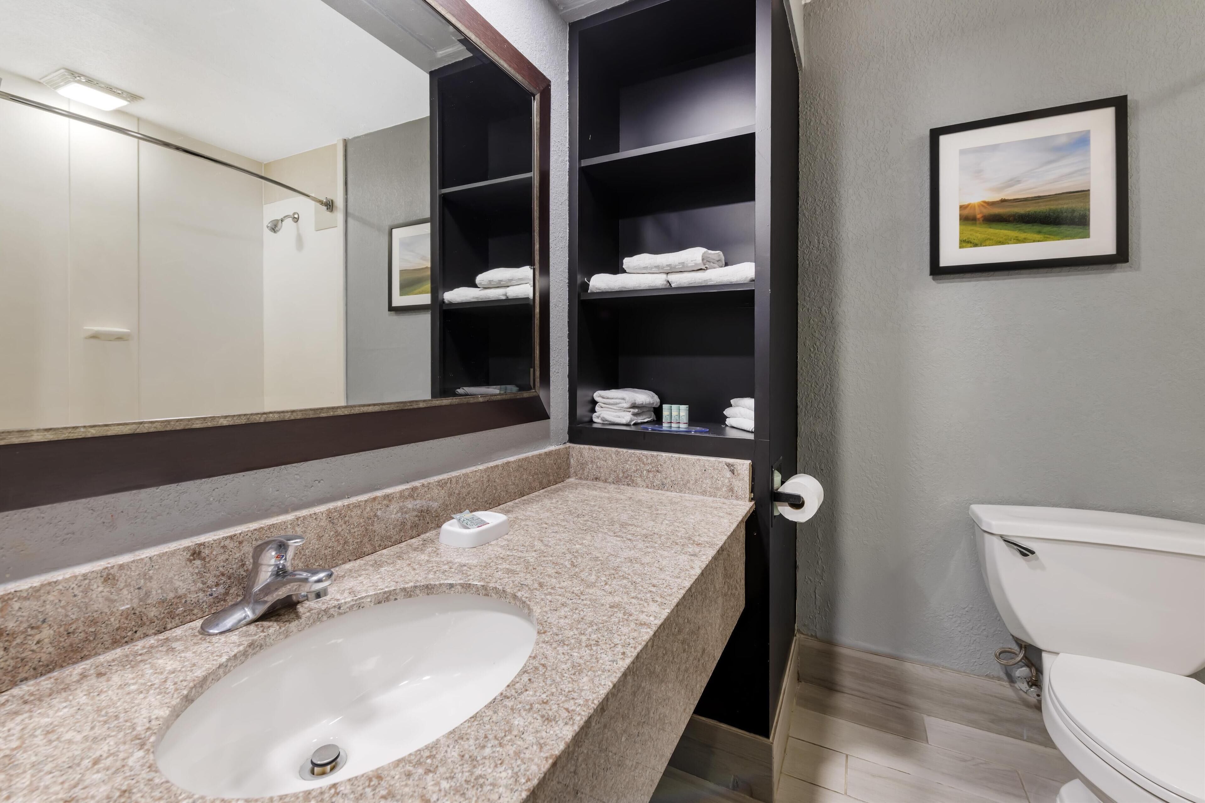 standard room, 2 queen beds, non smoking, refrigerator & microwave | bathroom | combined shower/bathtub, free toiletries, hair dryer, towels