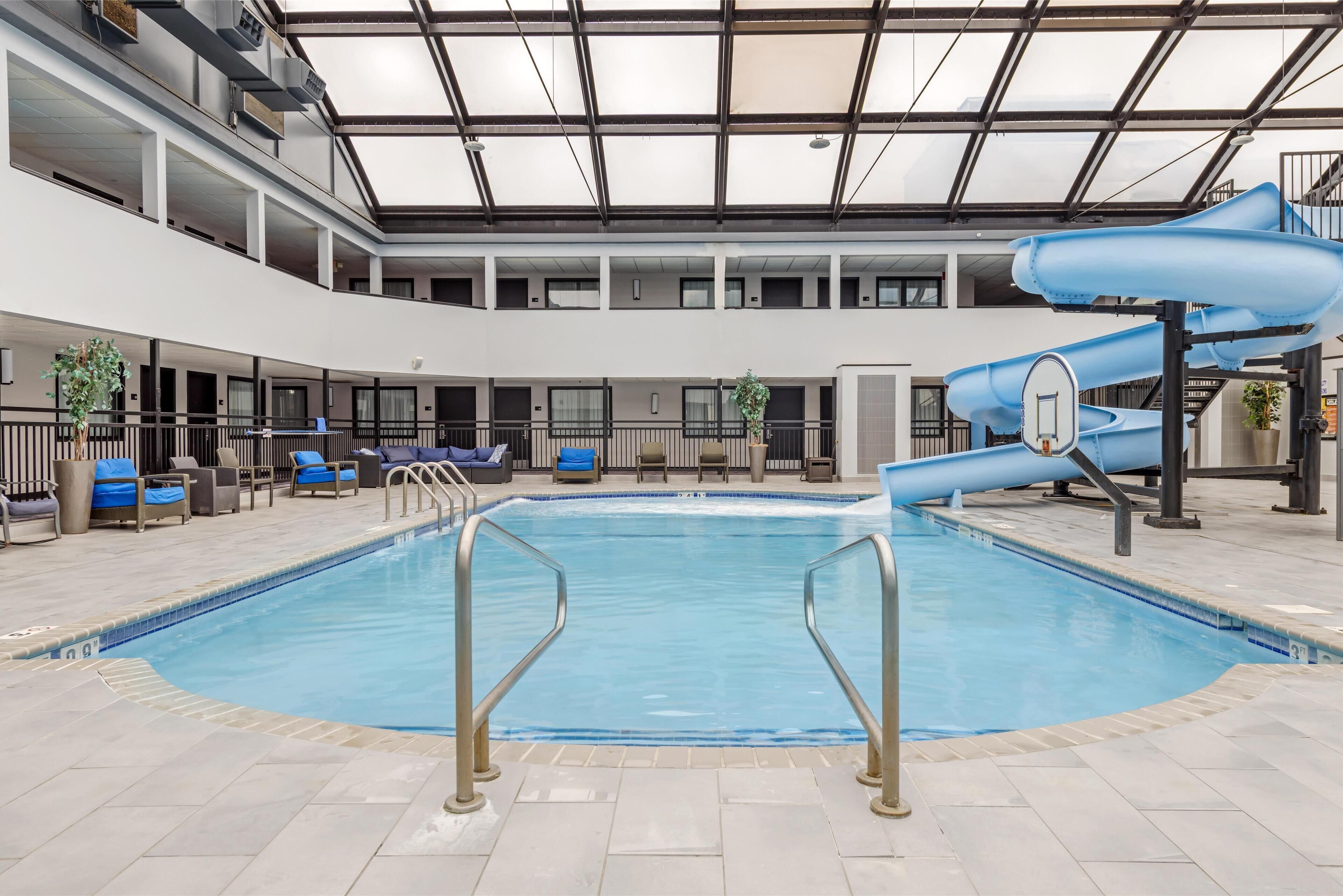 indoor pool, open 9:00 am to 10:00 pm, pool umbrellas, pool loungers