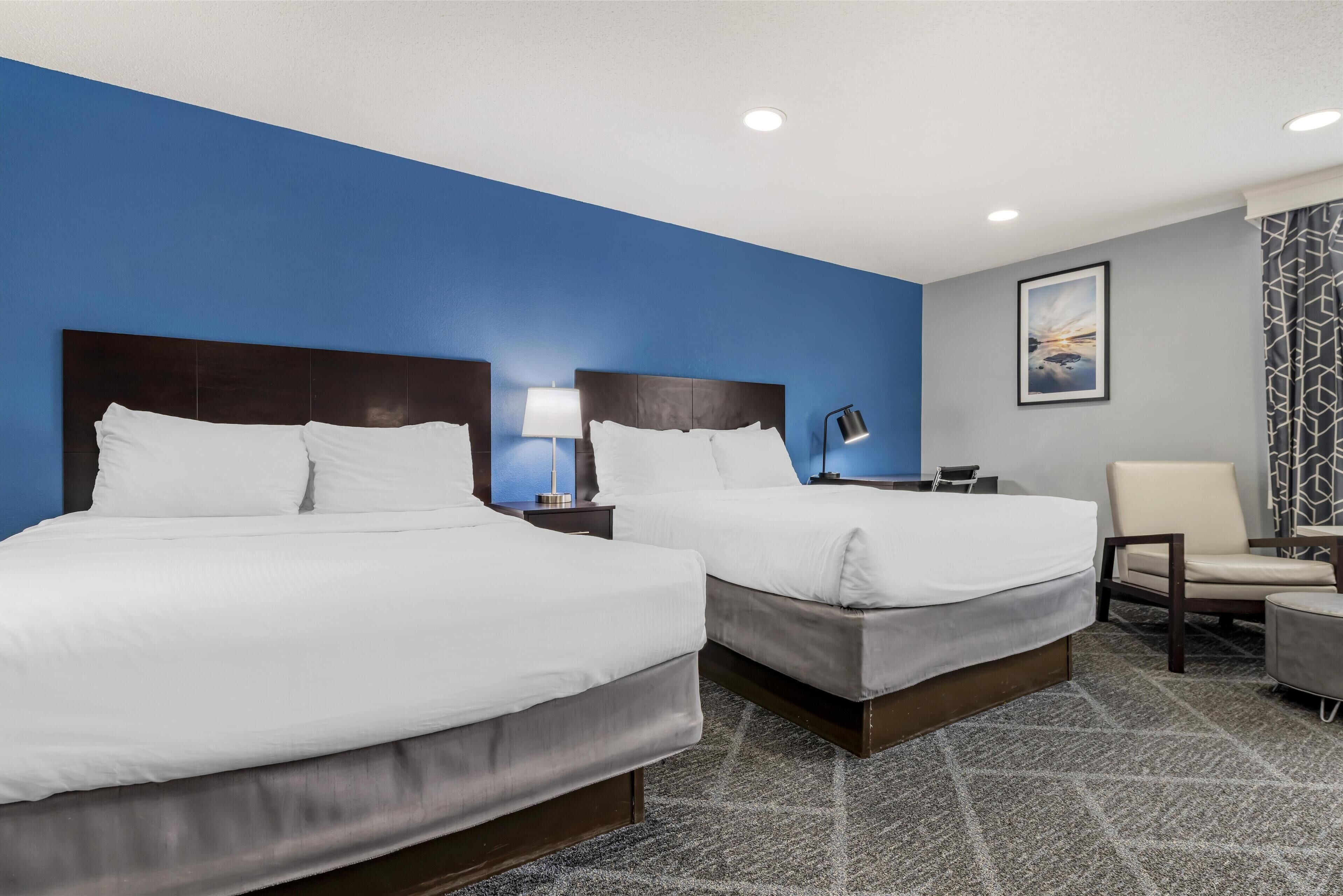 executive room, 2 queen beds, non smoking, refrigerator & microwave (living room) | 1 bedroom, blackout curtains, soundproofing, iron/ironing board