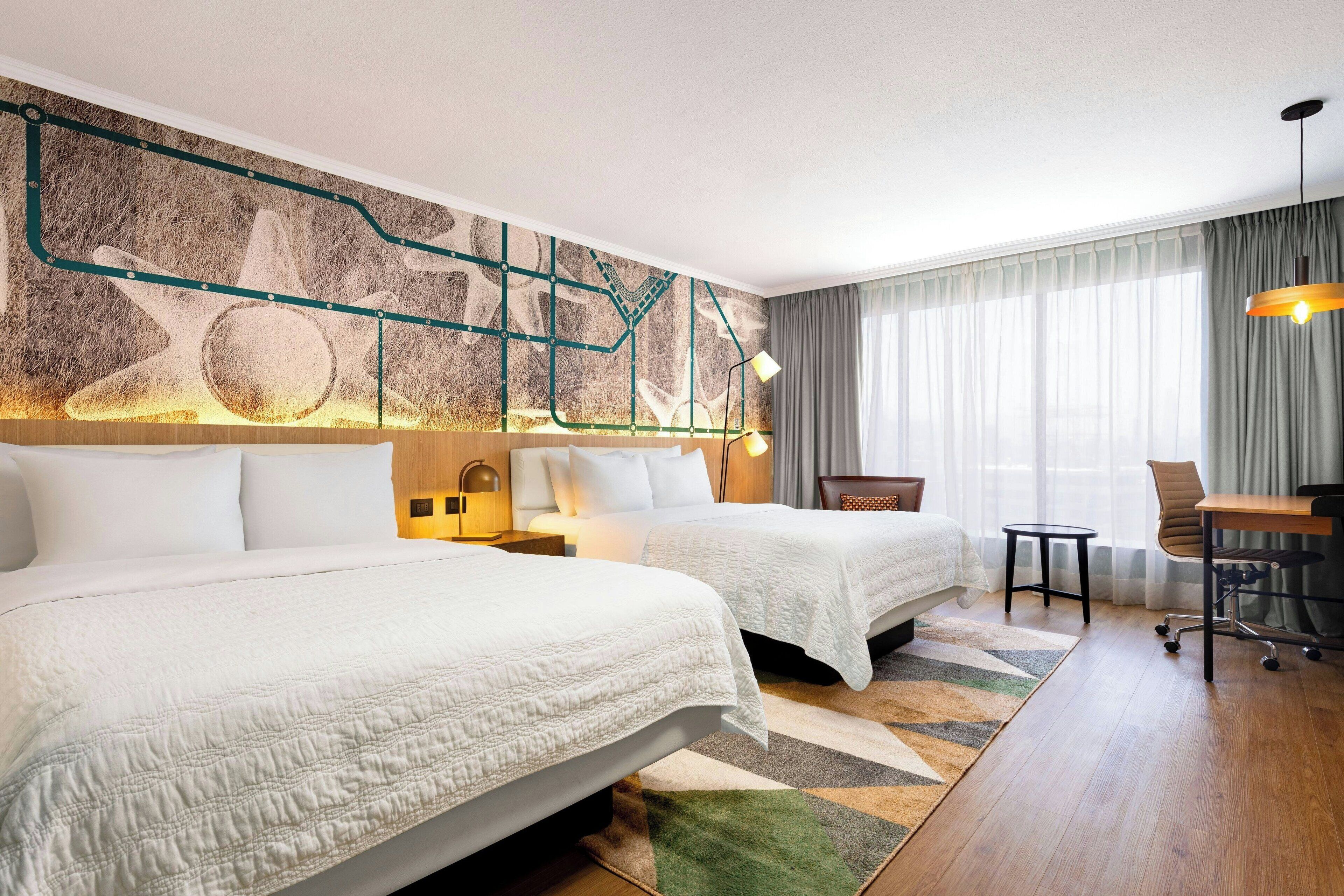 deluxe room, 2 queen beds, city view | 1 bedroom, premium bedding, down duvets, pillow-top beds